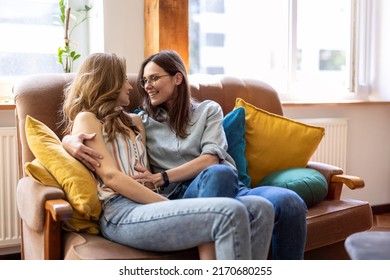 Happy affectionate lesbian couple at home
 - Shutterstock ID 2170680255