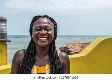 Happy Africa Woman From Ghana Stands On The Coast In Accra City.