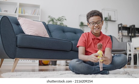 Happy African American Boy Playing With A Doll, No To Gender Stereotypes In Toys