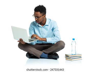 Happy African American College Student Sitting With Laptop On White Background