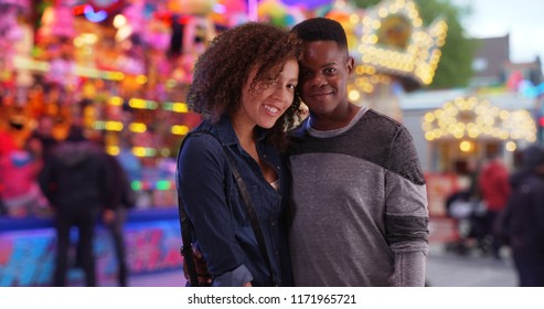 Happy African American Couple At The Carnival Pose For A Portrait