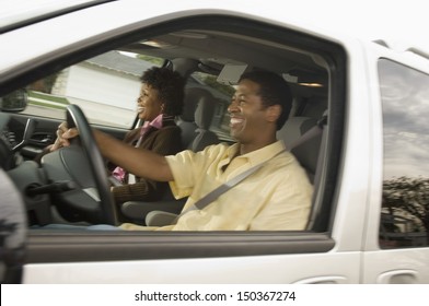 Happy African American Couple Driving Car