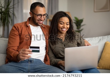 Similar – Image, Stock Photo Smiling couple using gadgets while spending time together