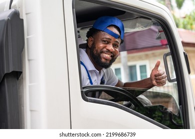 Happy African American Driving Delivery Men In Truck	