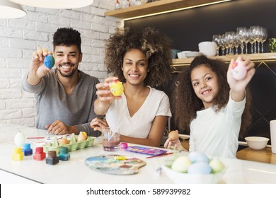 Happy African American Family Coloring Easter Eggs