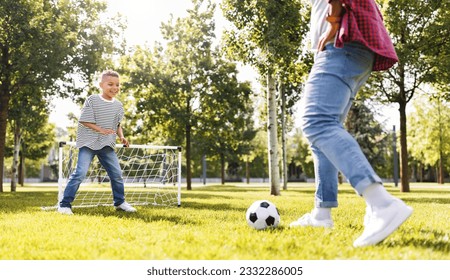 Happy african american family father and son playing football in the park in summer
 - Powered by Shutterstock