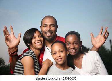 Happy African American Family. Father With Three Teenage Daughters Together Having A Good Time.