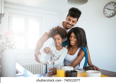 Happy African American Family Having Breakfast Together.