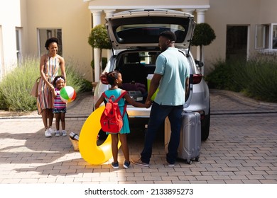 Happy African American Family Loading Luggage In Car Trunk While Going For Picnic. Unaltered, Family, Lifestyle, Transportation, Childhood, Leisure Activity And Weekend Activities.