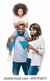 Happy African American Family With One Child Using Digital Tablet Together Isolated On White