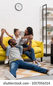 Happy African American Family Spending Time Together At Home