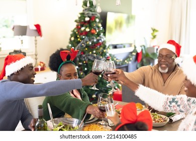 Happy African American Family Spending Time Together Having Christmas Meal. Christmas, Family Time And Celebration Concept.