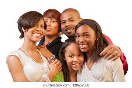 Happy African American family with teenage kids smiling on white background. Shallow DOF, focus on children.