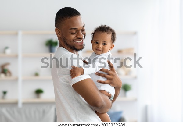 Happy African American Father Cuddling His Stock Photo 2005939289 ...