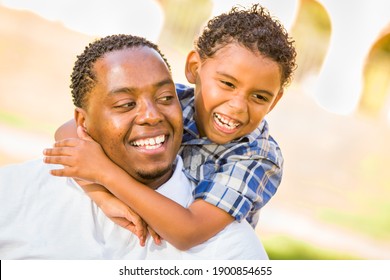 Happy African American Father and Mixed Race Son Playing At The Park. - Shutterstock ID 1900854655