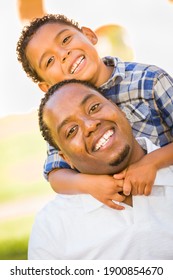 Happy African American Father and Mixed Race Son Playing At The Park. - Shutterstock ID 1900854670