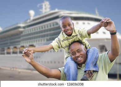 Happy African American Father And Son In Front Of Cruise Ship.