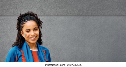 Happy African American Female Sports Fan During Word Cup Looking At Camera. Copy Space.