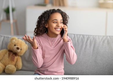 Happy African American Girl Talking On Smartphone, Enjoying Conversation With Friend