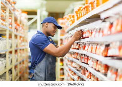 Happy African American Hardware Store Worker Working In The Shop