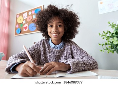 Happy African American Kid Child Girl School Student Looking At Web Cam Talking With Remote Teacher Distance Learning Video Conference Call Virtual Class Lesson, Headshot Zoom Portrait, Webcam View.