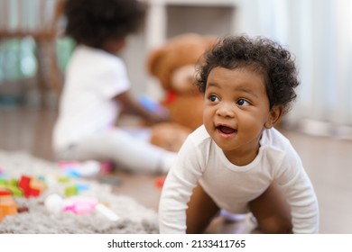 Happy African American Little baby boy crawling and looking for some thing to learn - Powered by Shutterstock