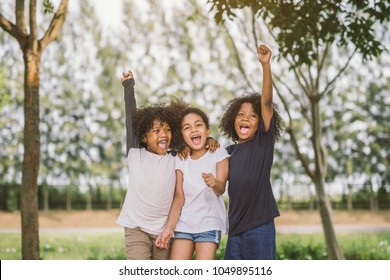 Happy African american little boy kid children joyfully cheerful and laughing. Concept of happiness, gladness and fun. 