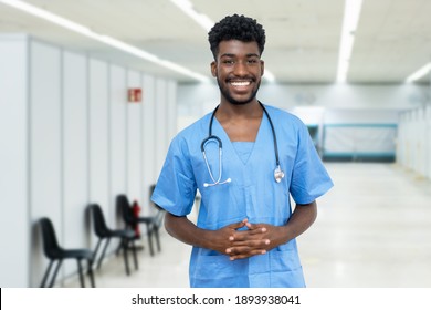 Happy African American Male Nurse With Beard At Vaccination Station Is Ready For Vacinating Patients Against Coronavirus Infection