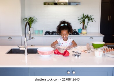 Happy African American Messy Girl Baking In Kitchen. Baking And Cooking, Childhood And Leisure Time At Home.