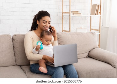 Happy African American Mother With Baby Infant Chatting On Phone Using Laptop Computer Sitting On Couch At Home. Maternity Leave, Modern Motherhood Lifestyle And Child Care Concept - Powered by Shutterstock