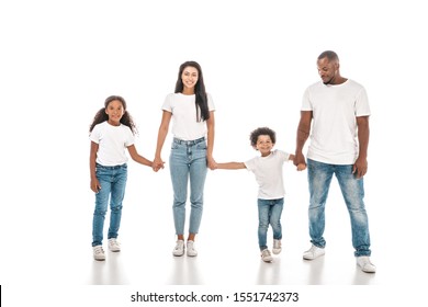 happy african american mother, father, daughter and son holding hands and smiling on white background