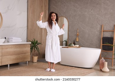 Happy African American woman dancing in bathroom - Powered by Shutterstock