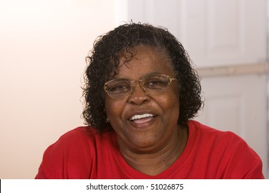 Happy African American Woman Wearing Glasses Smiling.