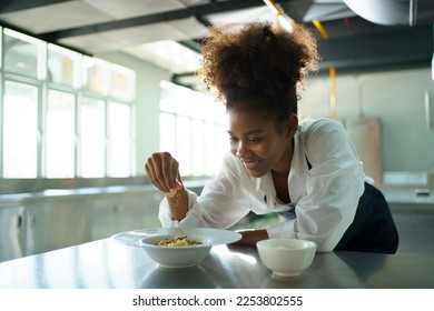 Happy African - black professional chef cooking in kitchen in restaurant. - Powered by Shutterstock