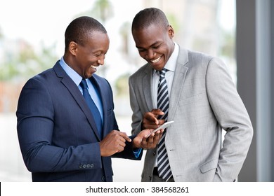 Happy African Businessmen Using Smart Phone