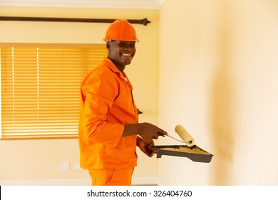 Happy African Contractor Painting Inside The House