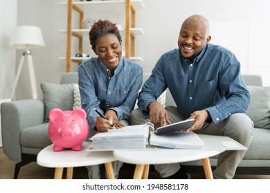 Happy African Couple Doing Retire Finances Plan And Money Budget