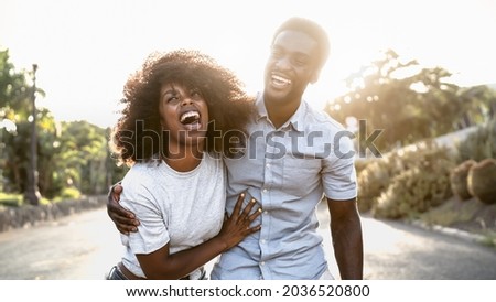 Happy African couple having fun dating outdoor 
