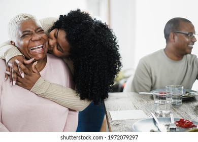 Happy African Daughter Having Tender Moment During Lunch At Home - Main Focus On Mother Face