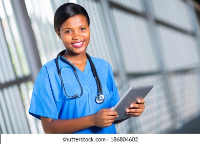 Happy African Doctor Using Tablet Computer