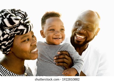 Happy African family having fun on the beach during summer holidays - Parents love concept 