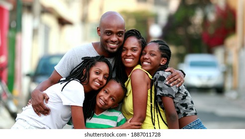 Happy African Family Portrait Standing For Photo Outside. Cheerful Black Parents And Children