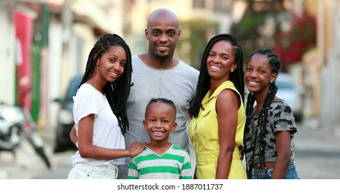 Happy African Family Portrait Standing For Photo Outside. Cheerful Black Parents And Children