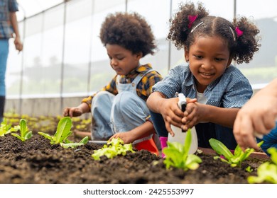 Happy African farmer family on agriculture farm growing organic vegetable together in greenhouse garden. Parents and little child kid working nature and gardening healthy food for sustainable living. - Powered by Shutterstock