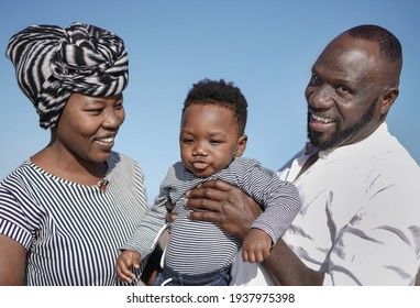 Happy African Father And Mother Having Fun With Little Son Outdoor - Black Family, Parents And Child Love