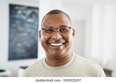 Happy African Man Looking At Camera Indoors At Home - Focus On His Face