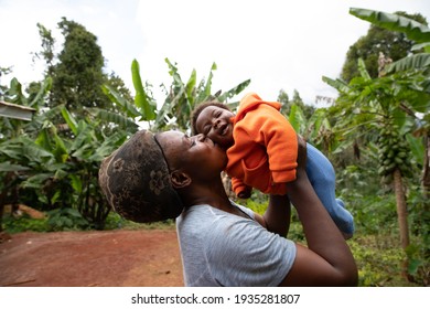 happy African mother kisses her newborn daughter. Mother's Day concept