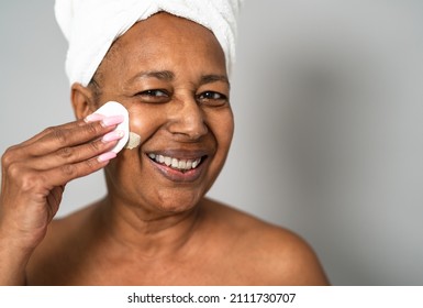 Happy African Senior Woman Having Skin Care Spa Day - People Wellness Lifestyle Concept