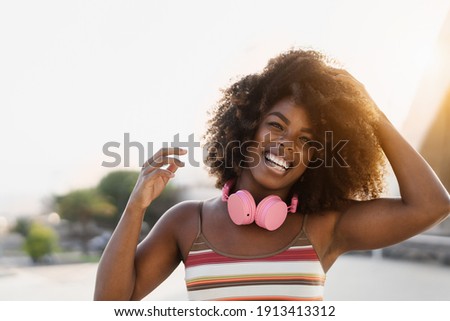 Happy african woman having fun smiling in front of camera