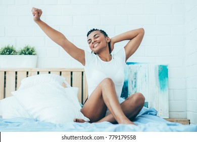 Happy African Woman Waking Up